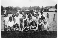 c. 1930 Sunday School Outing, at Wicksteed Park.Front row: Poppy Broom, Eileen Carpenter, Heather Portlock, Dora Gibson, Roy Eaglestone, Sylvia Portlock.Middle row: John Stevens (in shirt) Nigel Wood, Roy(?) Portlock, June Shirley, Cyril Shirley, Horace Wood (in shirt), Rita Stewart and Kathie Bolton (in black cap).