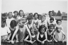 Back row: Ella Reeves, Daphne Cox, Dorothy Wood, Jube Shirley, Pat Probitts, Violet Bolton (n hat), Alec Stewart.Middle row: John Stevens, ?, Roy(?) Portlock, Cyril Shirley, Stanley Wood, Rita Stewart, Kathie Bolton.Front right: Heather Portlock, Dora Gibson, Roy Eaglestone, Sylvia Portlock.