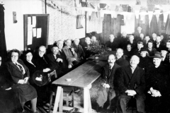 1930s Party at the Mission Hall. Left row, second in: Lydia Cross, Jimmy Hurst (with pipe). Right front row: Harry Matthews, James and Clara Matthews and Elsie Baker. At the back: Arthur Matthews.