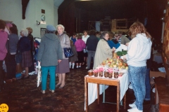 November 1989 Dorn Valley Venture Unit Jumble Sale. Middle left (facing) Charis Stevens. At stall: Bubbles Pratley and Mrs. Corbet.
