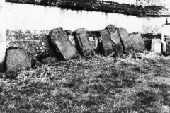 1966 Steeple Barton Church. Head stones (five of them Eaglestone memorials) put against the church's north wall when tombstones were removed in 1966.