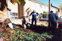 November 1986 Roy Eaglestone, John Woodley and Ken Castle (back view) uncovering the milestone buried by Roy's father in the Second World War.
