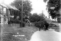 1920s Enstone Road looking east to the crossroads. North side: workshop of the Baker family, then cottages 6 to 2.