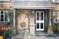 1989 When the buildings, formerly two cottages, were joined togther, this was built to hide the joint.