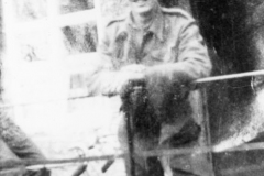 1950s John Fowler standing by Quaker Cottage.