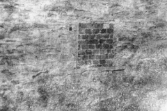 6 Mill Lane, bricked up window at Florence Farley's shop.