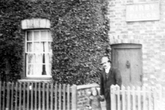 c. 1916 George Henry Kirby with his daughter Ruth Elizabeth Annie at the front of 67 North Street. He took over the tailoring business from his father.