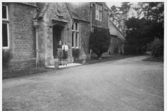 1942. Entrance to Westcote Barton Manor (Hostel). Olive and I.