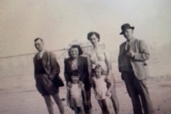 P0171_ISunday School seaside outing early 1950’s. Fred, Eileen, Jean and  Harry Carpenter. Children Barry & Jean Ogle. My grandfather Harry Carpenter  always wore a hat when outside. A cap for working and gardening, a trilby  routinely and a bowler for more special occasions.G_5_0462