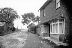c. 1926 Left side: 21/23 North Street, Post Office 1895-1932 and a builder's workshop. Right side: 20 North Street and the Three Horseshoes.