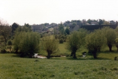 View of the Dorn stream and houses beyond on South Street, Mill Lane and Church Lane from North Street.