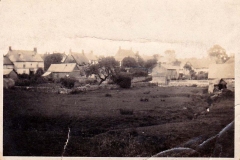 Looking north-east from Holliers field. At top left, the front of Farley's house and shop. The building on the right is a now-demolished part of the old mill. Also demolished cottages in Jacob's Yard.