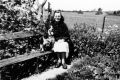 1930s Henrietta Davies sitting on a seat in Church Lane below Stewarts' bungalow.