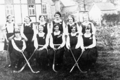 Back row 4th for left: Olive now Long. Front row Ivy Probbitts?, 4th from left: Bubbles Stockford now Pratley.