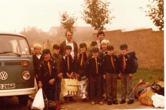 c. 1980 Bartons' Scout Group. Adults: left Lewis Yates (helper), right John Keefe (leader). Back row l to r: Kevin Benn, ?, Stephan Cox, Paul Spry, Tim Yates, Martin Benn. Front row l to r: Matthew Hansen, ?, ?, Guy ?  (School 2)