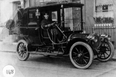 W. G. Checkley driving a taxi in London.
