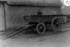 c. 1910. Bill Irons in his father's wagon outside Hollier's Farm Barn.