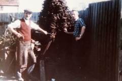 1960s 17 Worton Road. Frank Gascoigne and son Bill by pile of horseshoes.