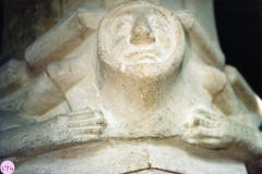 January 1987 Second capital from the easternmost pillar. Head with linked arms.