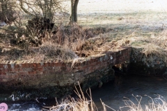 1986 Old water wheel near site of cottages in the Fields.
