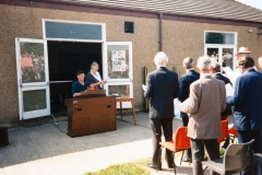 7 May V.E. Day Parade. Playing Fields. Derek and Deanne Gardner behind the organ. Robert Pim standing far left. Stan Wood closest to camera. Robin Fleming in hat.