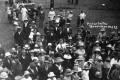 1923 Middle Barton Flower Show. Back: Joan Eaglestone as a child held by her mother, Doris Baker as a girl, her mother and her sister, Peggy, in a pram, Aunt Mabel standing by the pram.