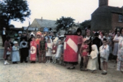 1960s Preparing for the Fancy Dress competition at the Barton Abbey fete. The children were taken from the Fox on a trailer pulled by a tractor.