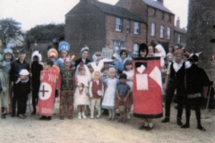1960s Preparing for the Fancy Dress competition at the Barton Abbey fete. The children were taken from the Fox on a trailer pulled by a tractor.