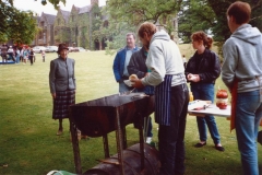 June 1987 Steeple Barton Church fete at Barton Abbey. Mrs. Joan Fleming, Eddie Harrison, Bill Edbury (Venture Scout Leader), Jo Yates and Tim Yates (Venture Scouts), manning the beefburger stall.