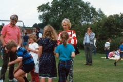 July 1987 Middle Barton School Fete - Matthew Houston on left, children William, Tricia and Angela. Joan Alexander in the centre. + ? John Hanks on the right.