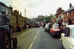 June 7 1977 Silver Jubilee procession - North Street. Lynda Mason, extreme right with dark hair, and Rob Mason (holding Samantha) - then living at Sebastian Cottage, North Street.