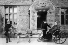 c. 1900 Reverend Jenner and Mrs. Marshall. Richard Buswell by the donkey's head.